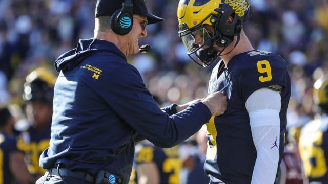 Michigan coach Jim Harbaugh talks to quarterback J.J. McCarthy before the start of the Rose Bowl vs. Alabama in Pasadena, California, on Monday, Jan. 1, 2024 